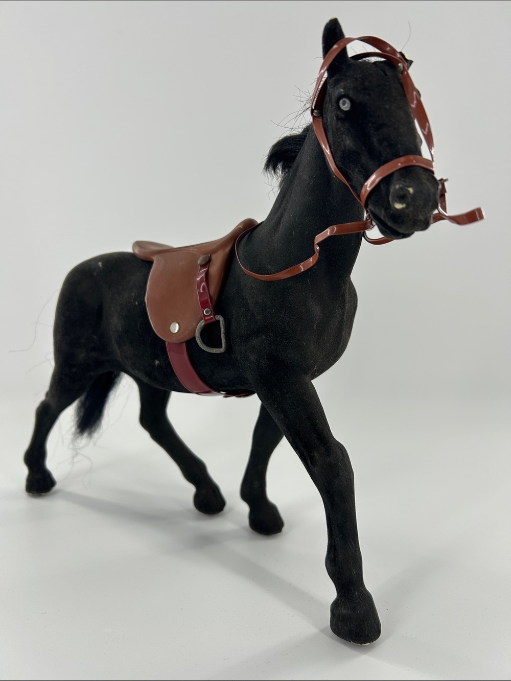 Black Toy Horse with Brown Saddle and Bridle